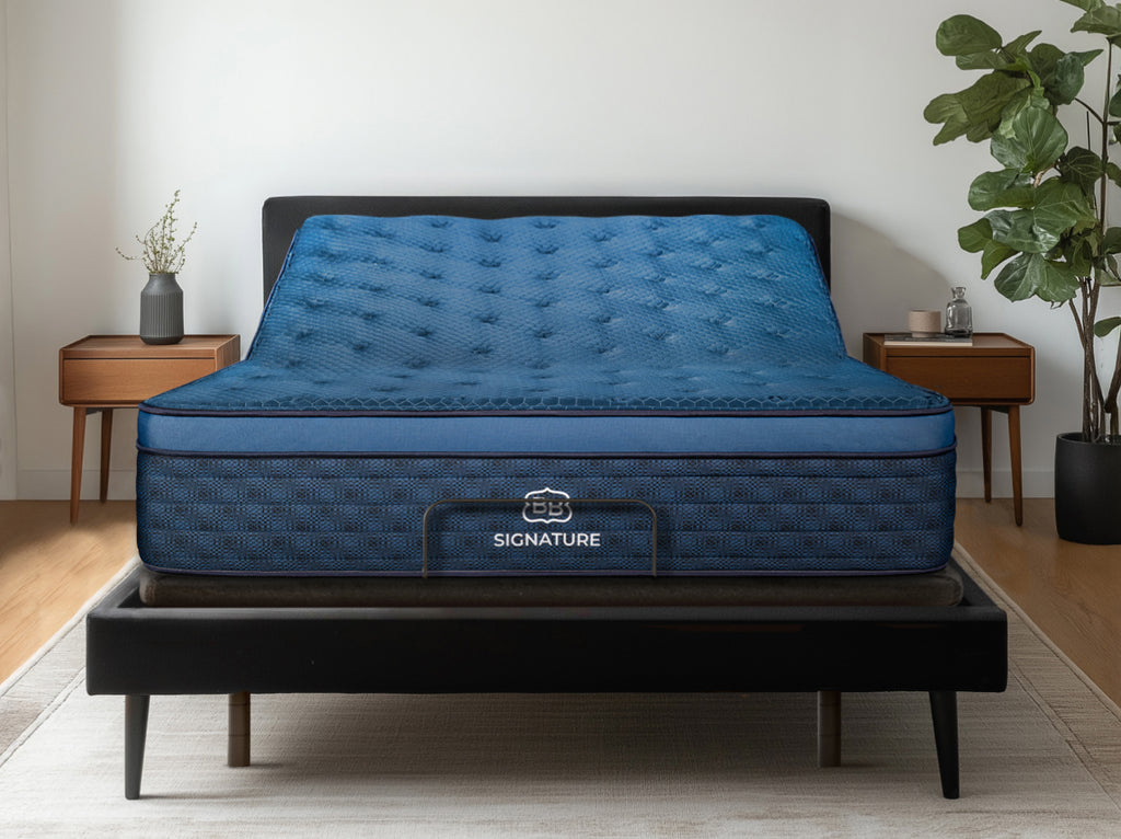 Brooklyn Bedding Signature Hybrid on the Ascension® Luxe Adjustable Power Base with the head section raised in a modern bedroom