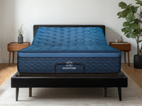 Brooklyn Bedding Signature Hybrid on the Ascension® Luxe Adjustable Power Base with the head section raised in a modern bedroom