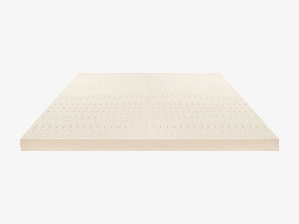 Front view of perforated Talalay latex mattress topper on a neutral background.