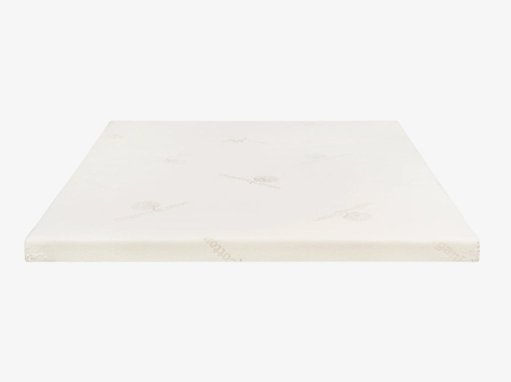 Talalay latex mattress topper encased in an organic cotton cover on a neutral background.