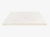 Talalay latex mattress topper encased in an organic cotton cover on a neutral background.